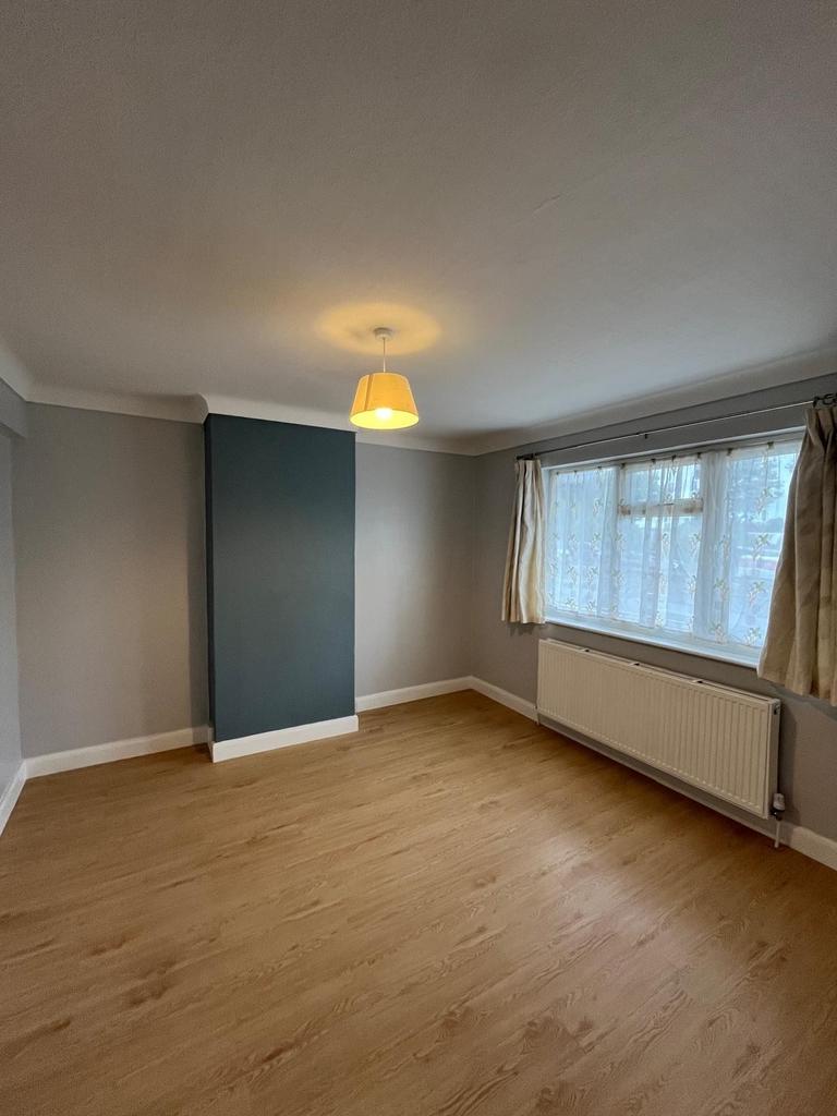 Bright, freshly decorated bedroom with light wo...