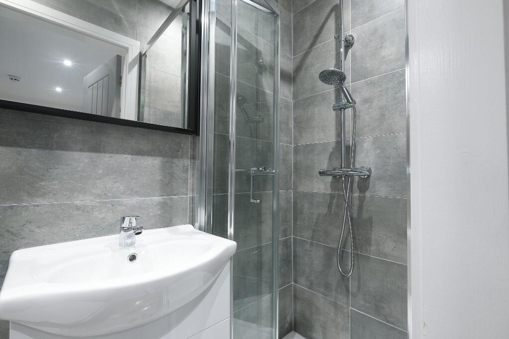 A modern, well-maintained bathroom featuring a ...