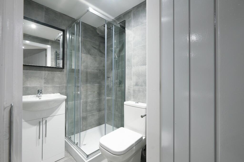 A modern, well-maintained bathroom featuring a ...