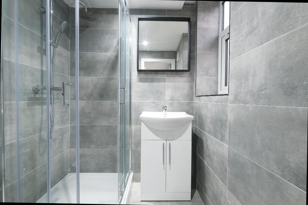 A modern, well-maintained bathroom with a spaci...