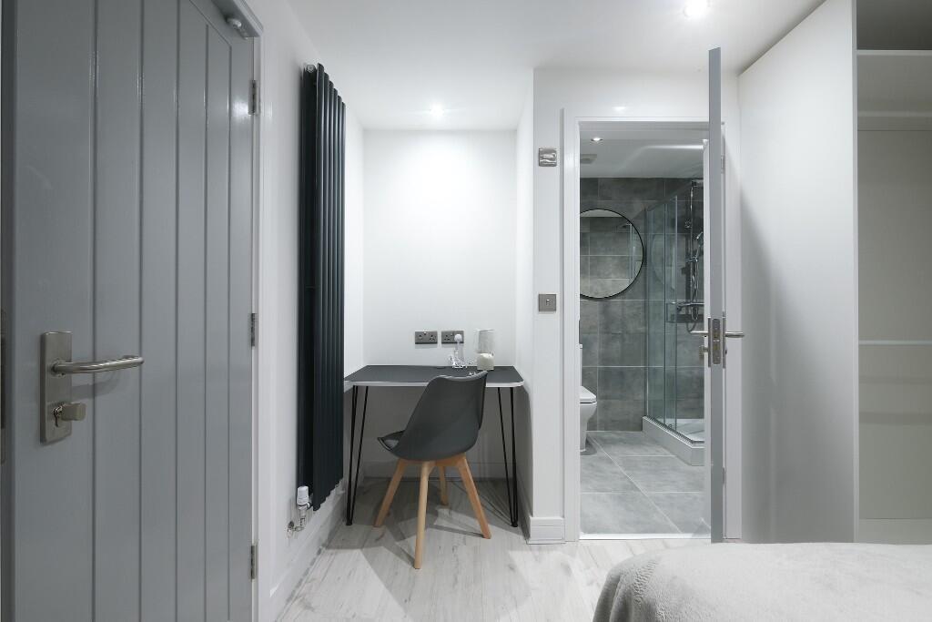 A modern, well-maintained bathroom with a spaci...