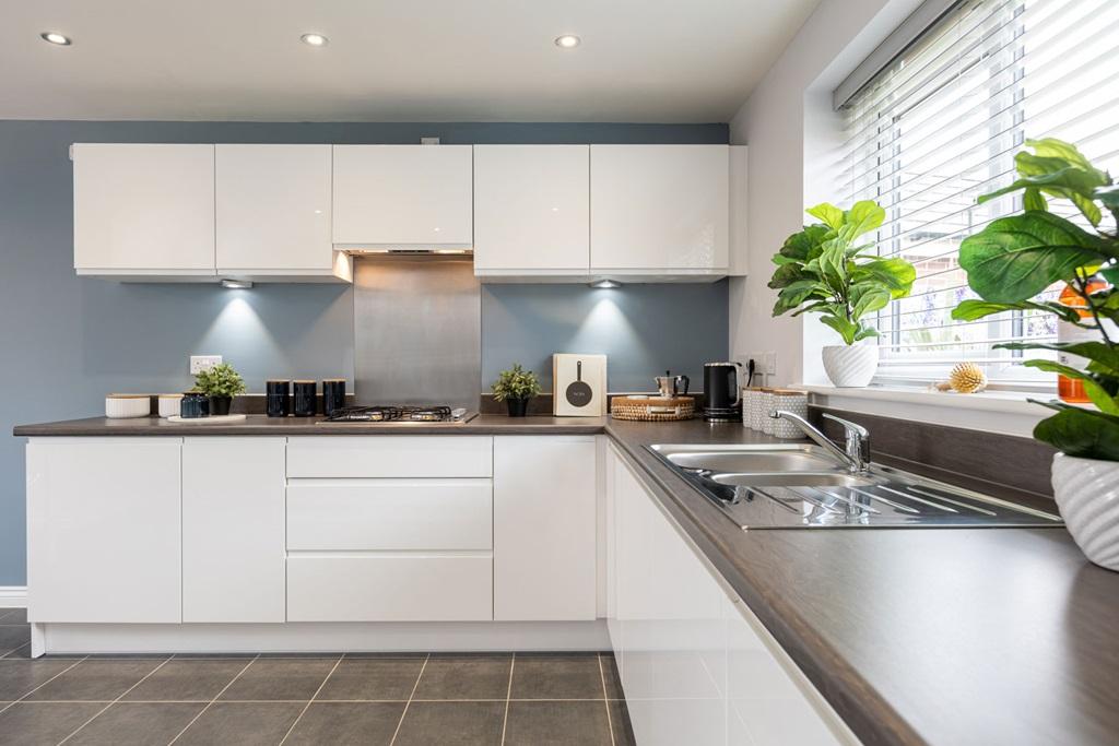 Modern kitchen with ample storage and worktop...