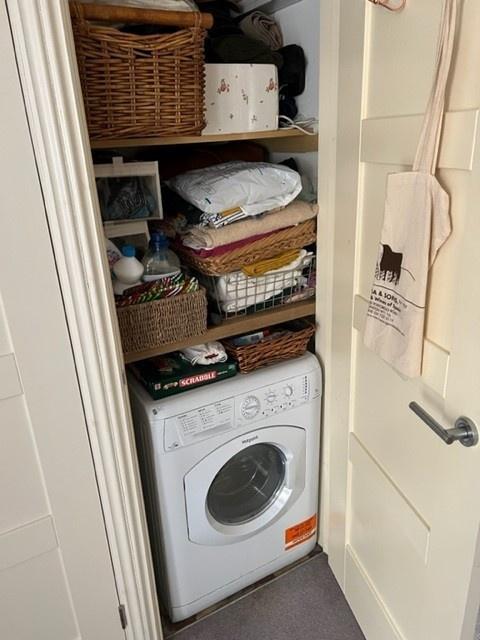 Neat laundry closet with an integrated washing ...