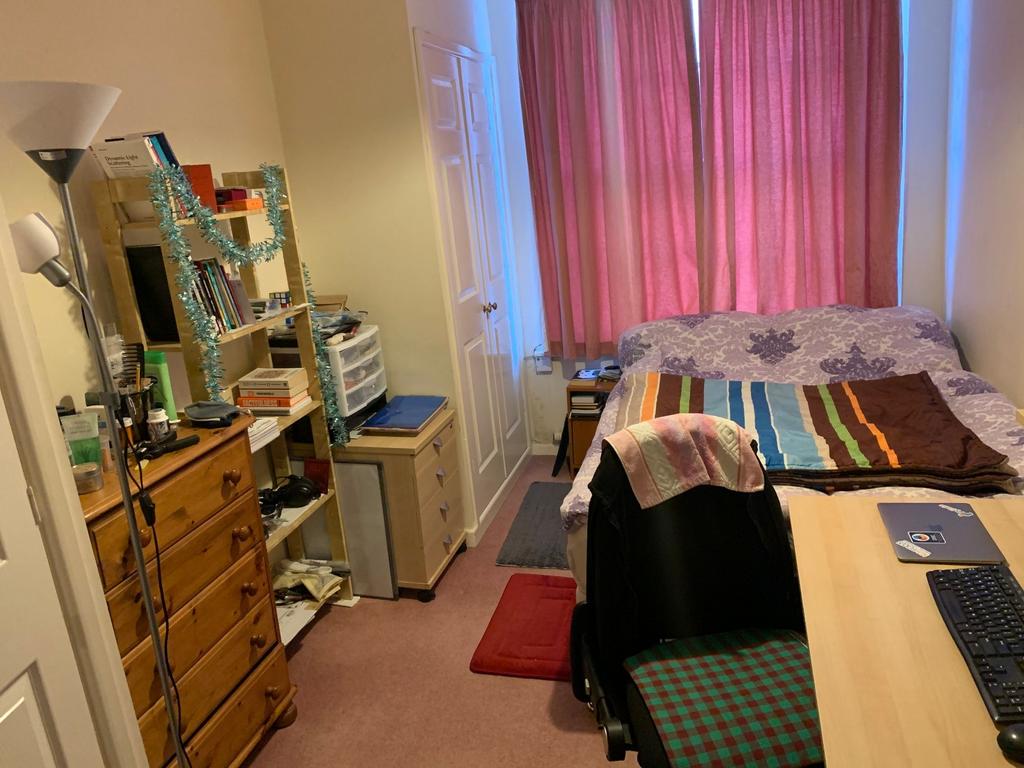 Bright, well-furnished bedroom with a comfy bed...
