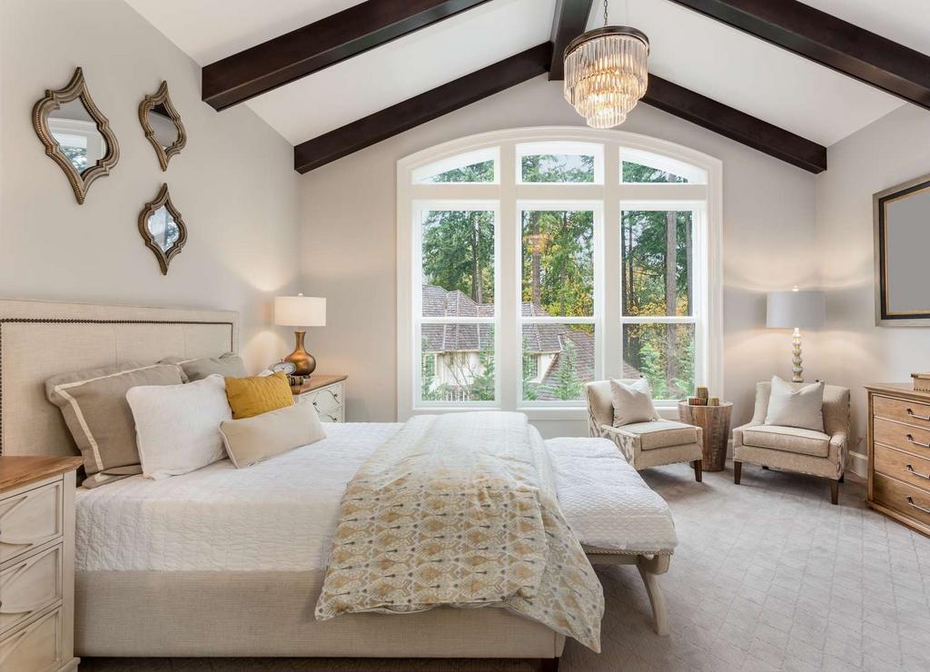 A spacious and beautifully decorated master bed...