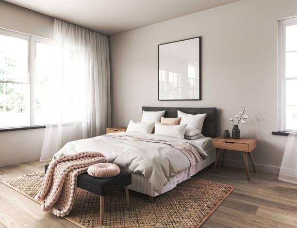 Bright and inviting master bedroom with a large...