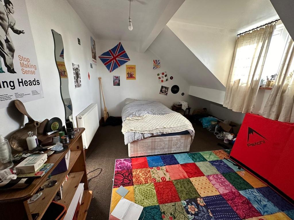 A spacious and inviting master bedroom with amp...