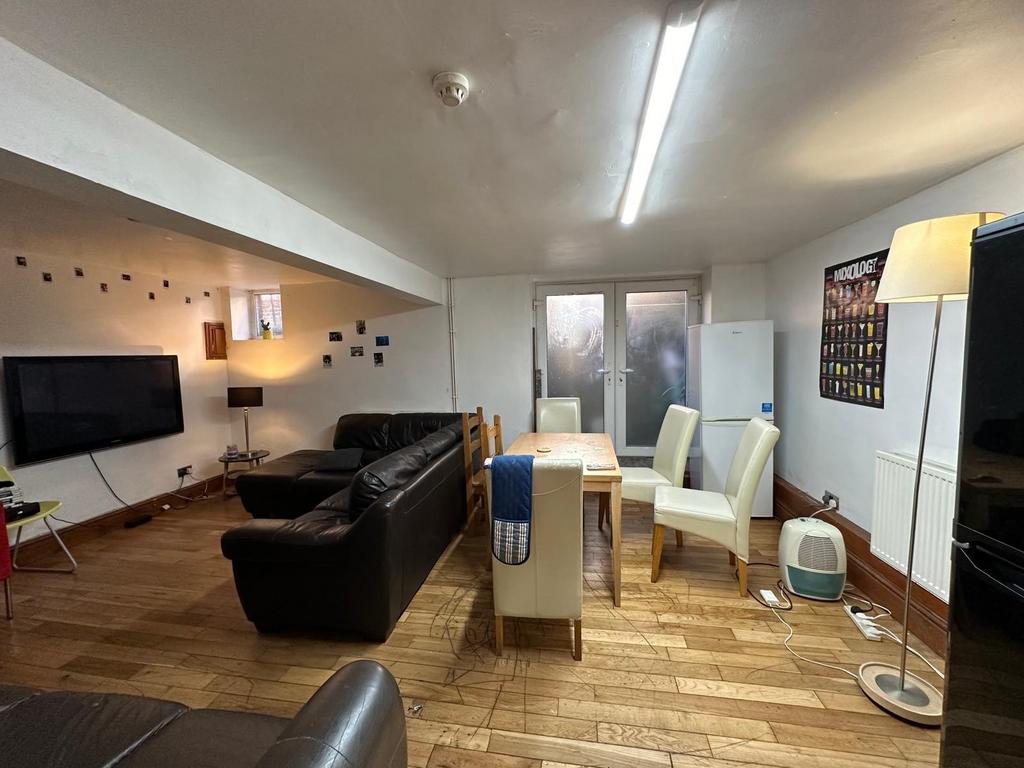 A spacious and modern living room featuring com...