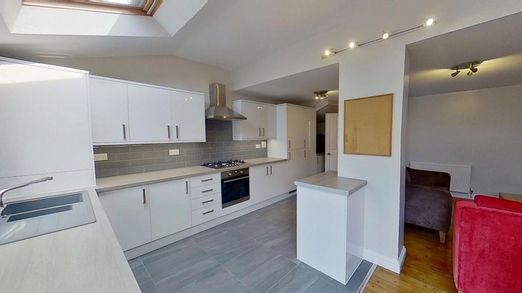 Bright modern kitchen with white gloss cabinets...