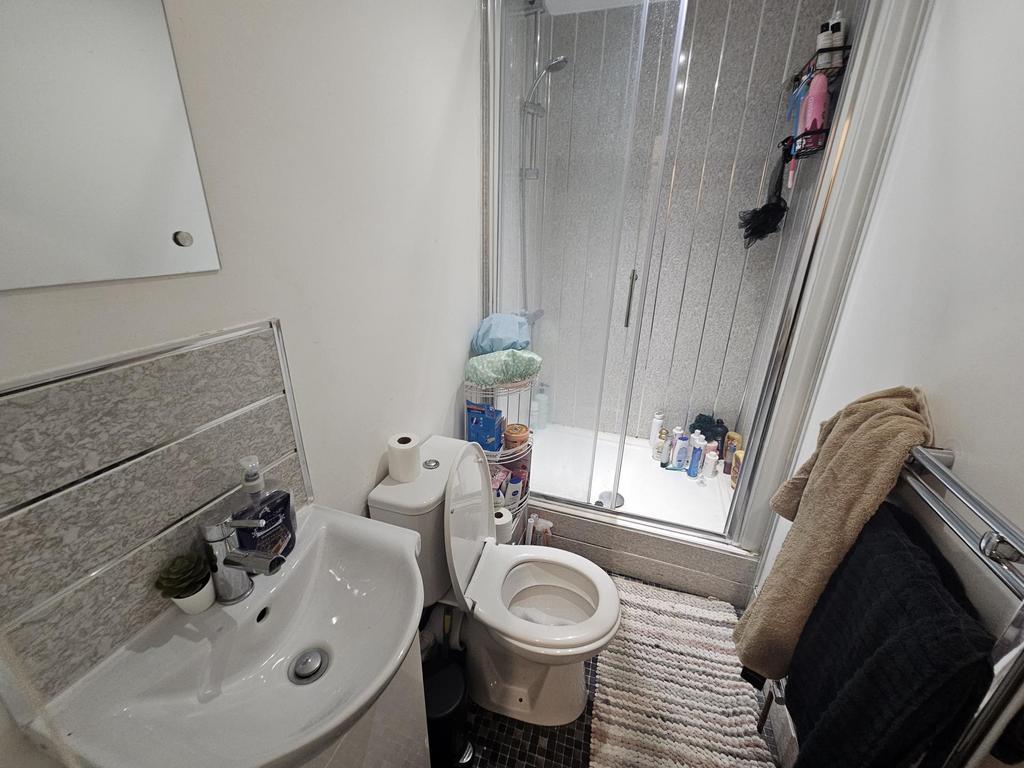 Bright small bathroom with a modern pedestal si...