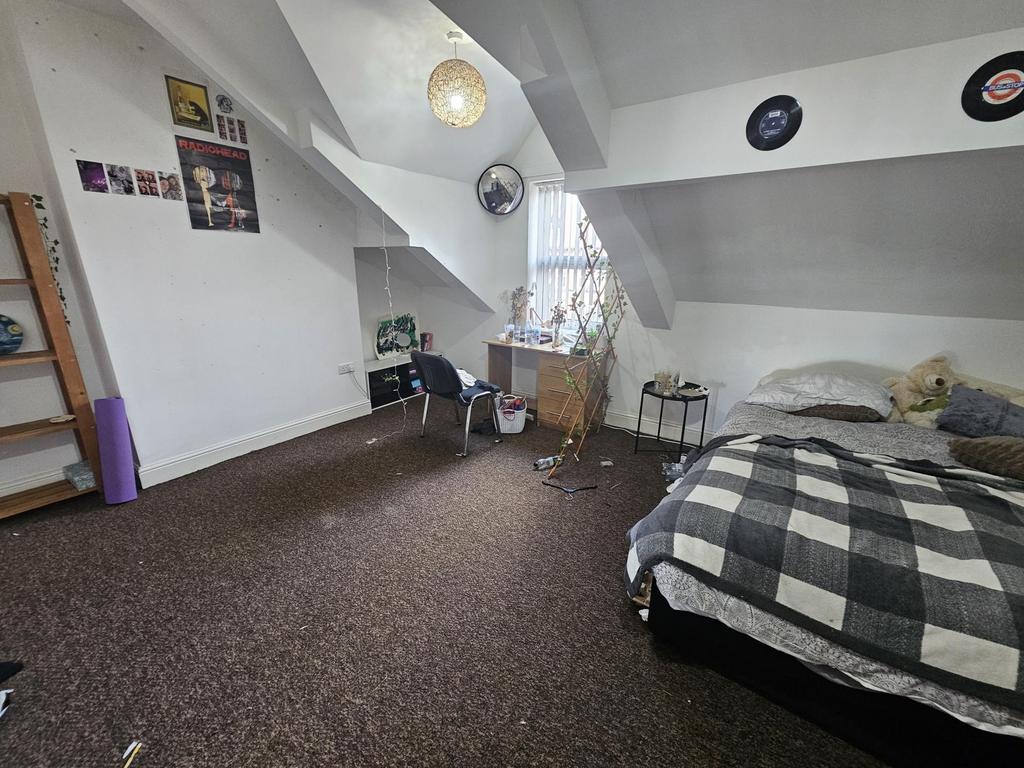 Bright attic double bedroom with sloped ceiling...