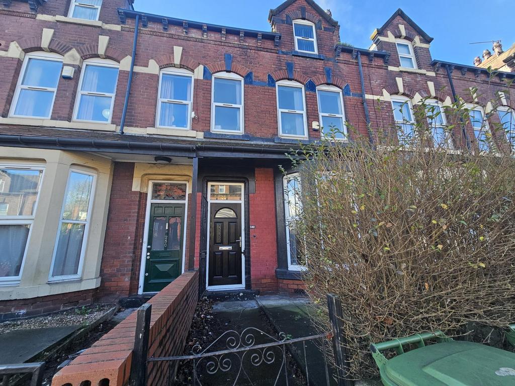 Victorian terraced house exterior with a covere...