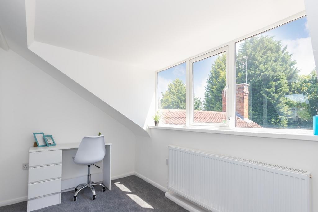 Bright single bedroom with a large dormer windo...