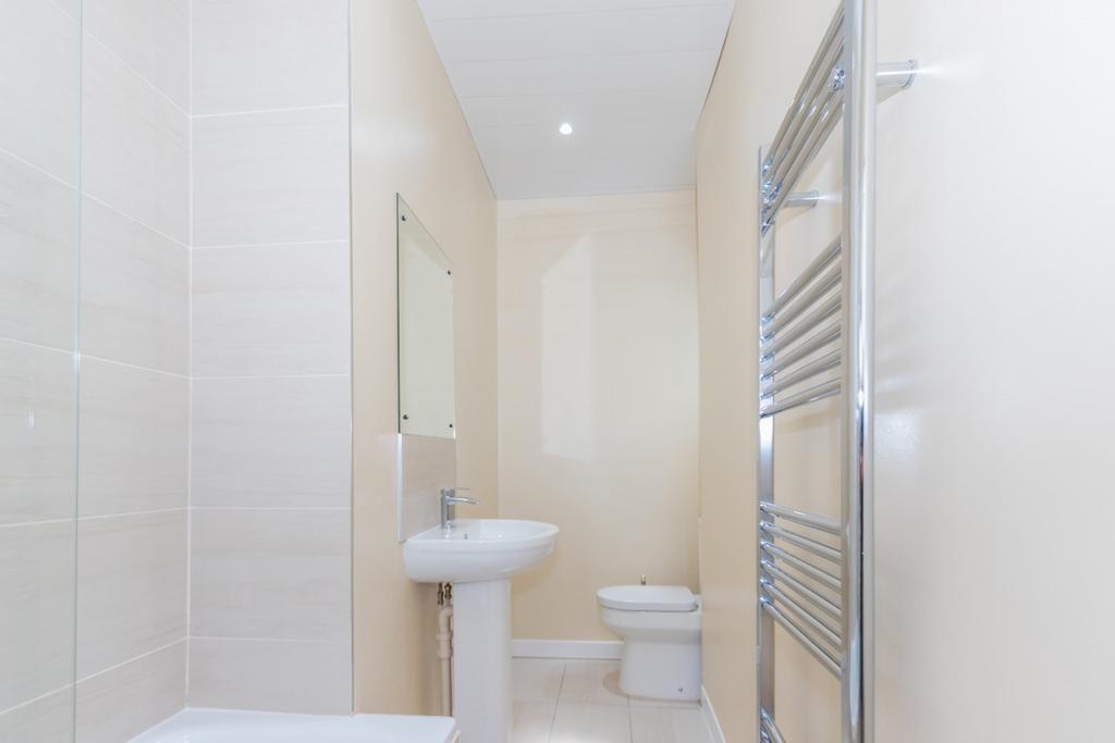 Bright, modern bathroom with white sanitaryware...