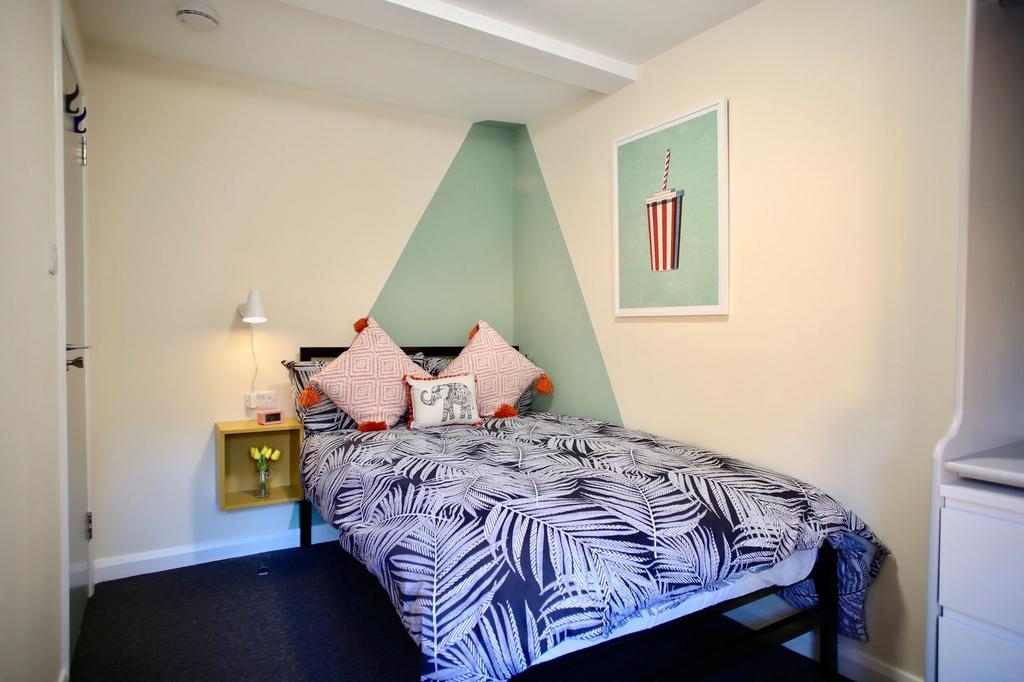 A neatly presented double bedroom featuring a s...