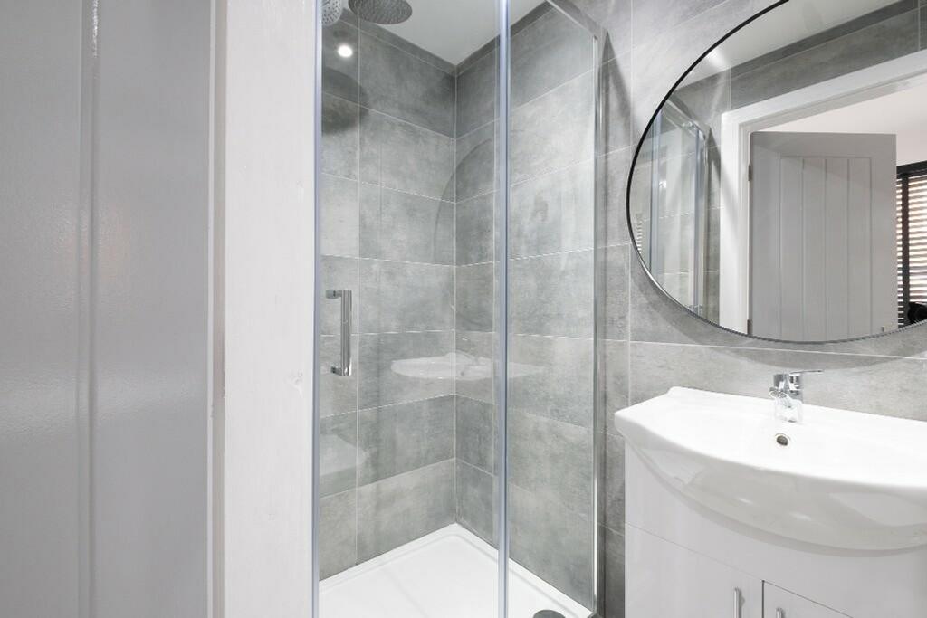 A modern and stylish bathroom featuring a sleek...
