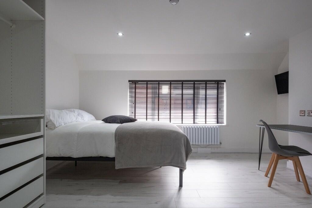 Bright and inviting master bedroom featuring a ...