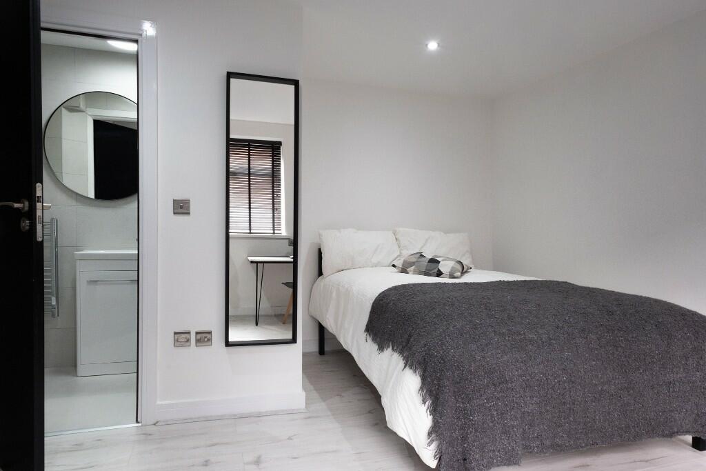 A spacious and well-maintained master bedroom f...