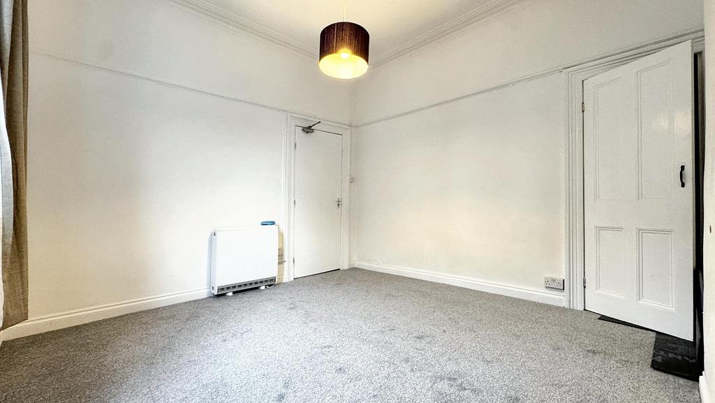 Bright, neutral bedroom with fresh white walls,...