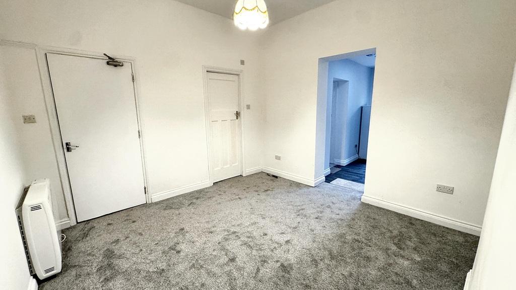 Bright, neutral bedroom with fresh white walls,...