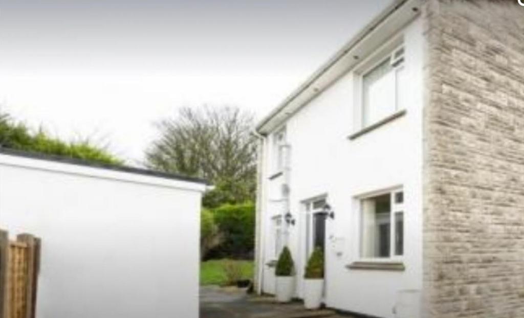 The inviting exterior of the property features ...