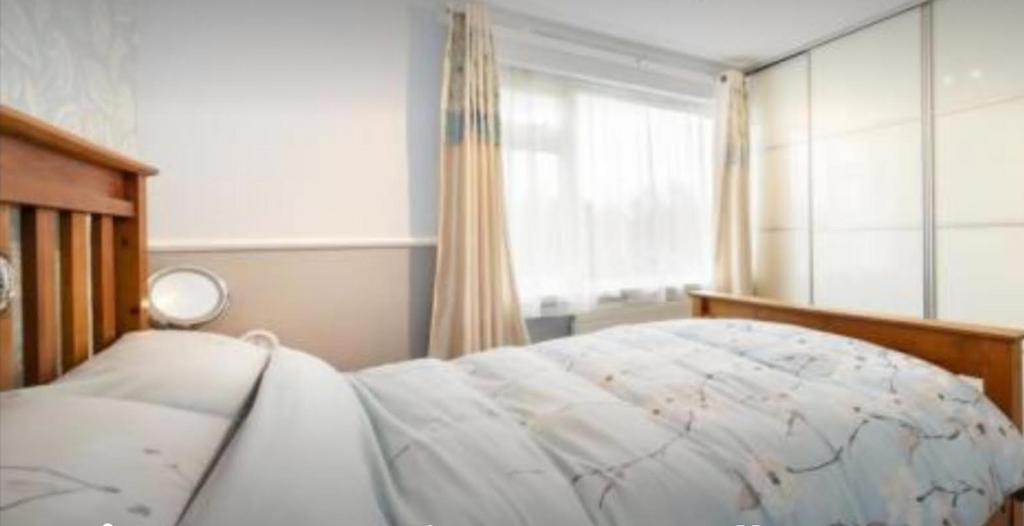 A bright and inviting double bedroom featuring ...