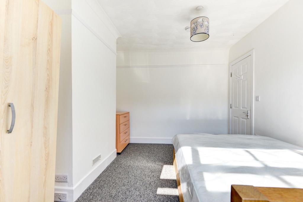 Bright and spacious master bedroom with ample n...