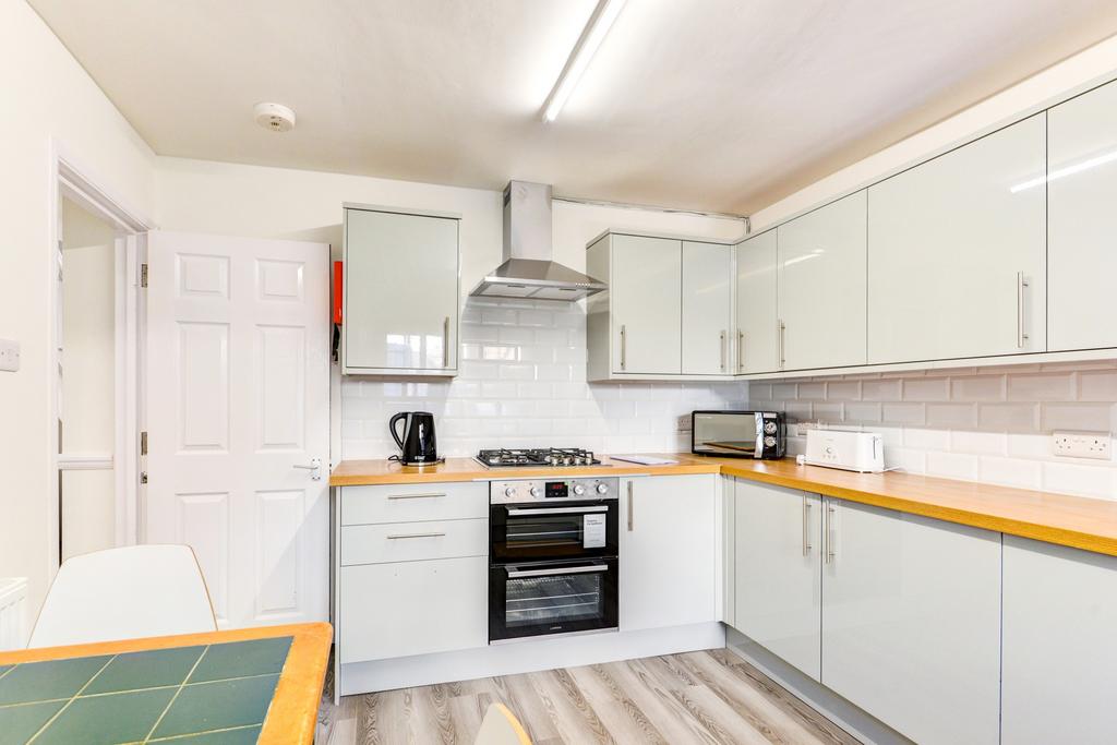A modern, well-maintained kitchen featuring whi...