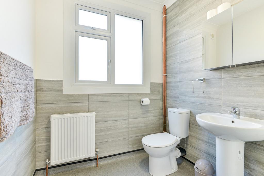 A modern, well-maintained bathroom featuring a ...