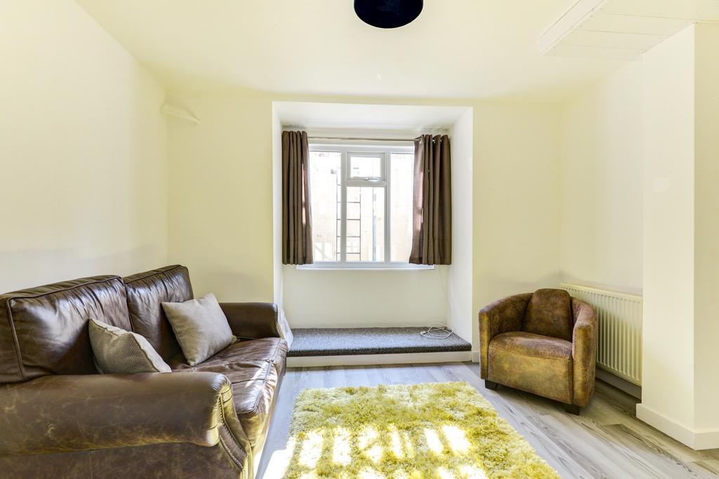 Bright and welcoming living room featuring a co...