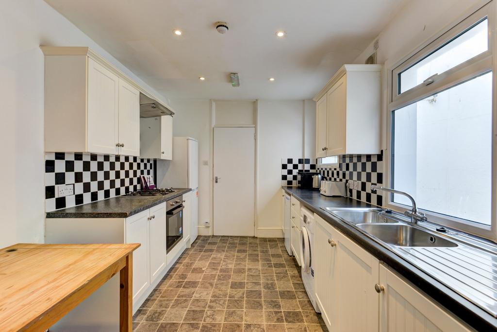 Bright and well-maintained kitchen with ample c...