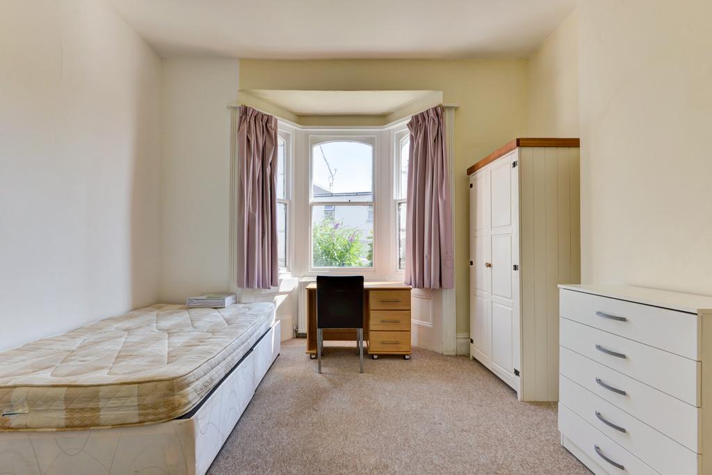 A bright and welcoming single bedroom featuring...