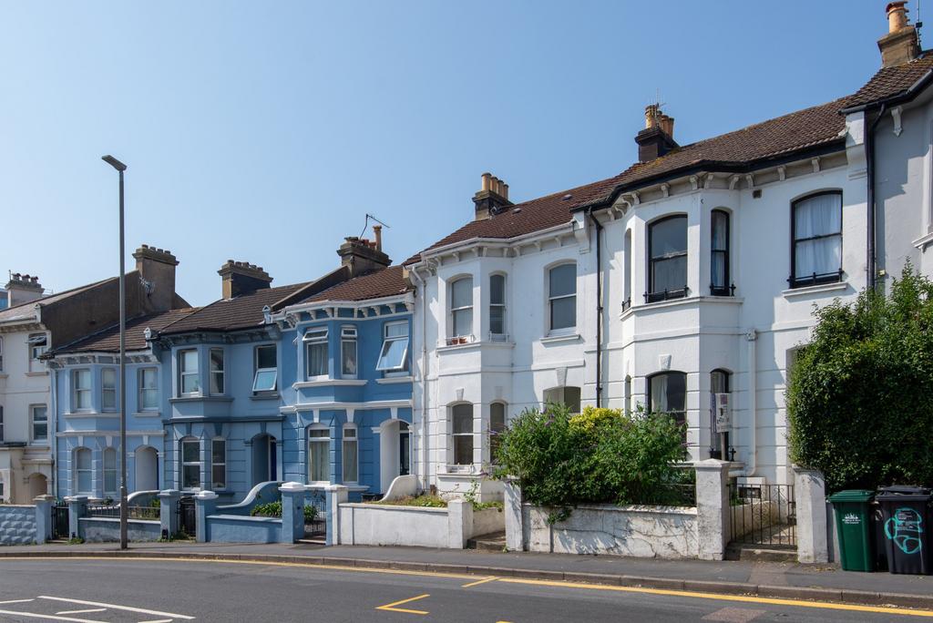 A charming row of Victorian-style terraced hous...