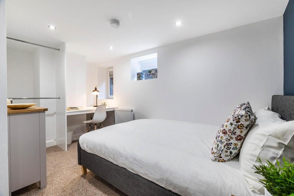 Neatly presented double bedroom with a comforta...
