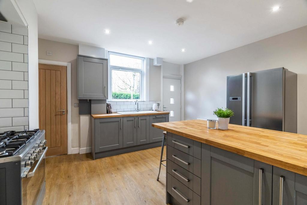 Bright, modern kitchen with a central island, i...