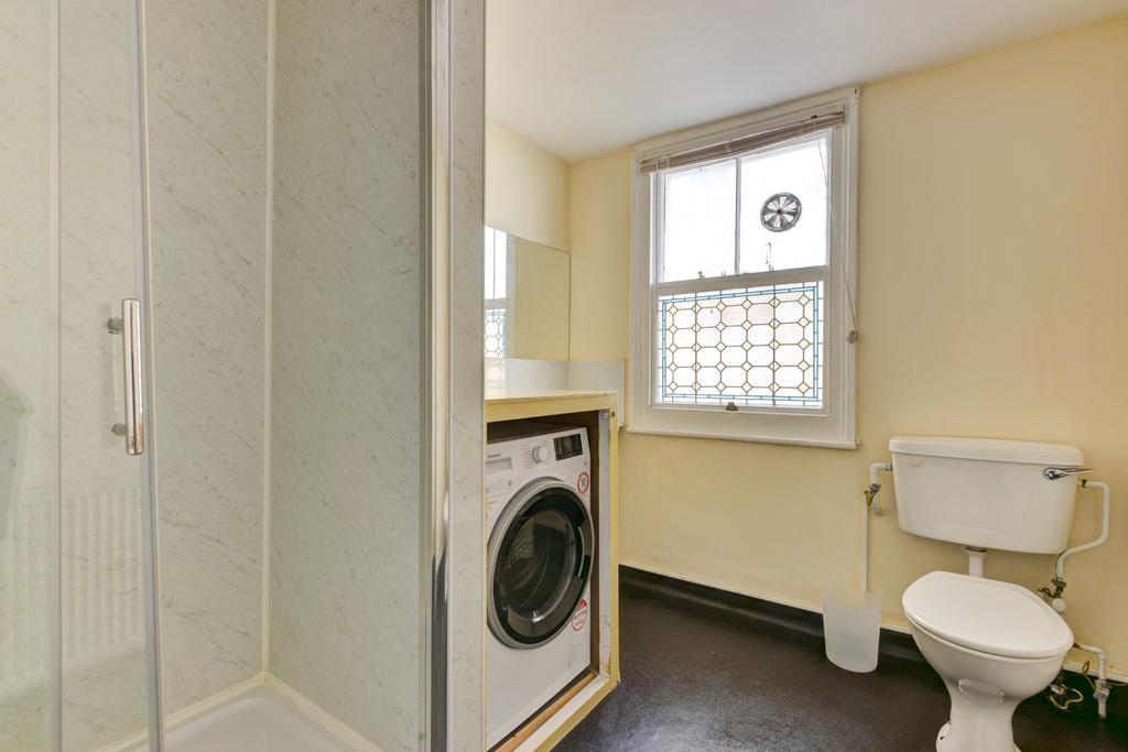 A clean and functional bathroom with a toilet a...