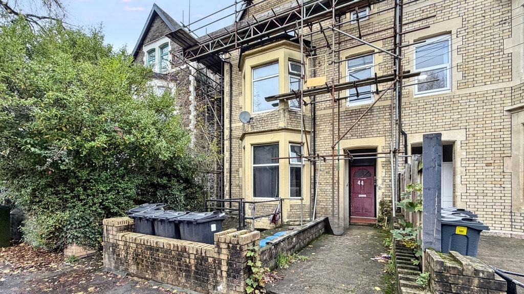Period terraced house frontage with bay windows...