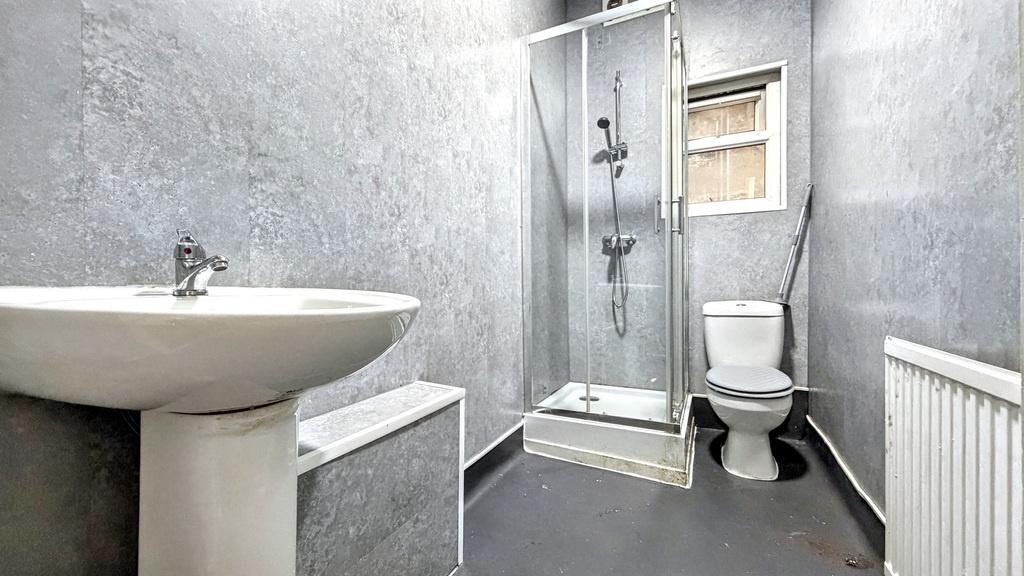 Contemporary bathroom with a corner shower, ped...