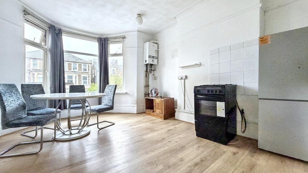 Bright, airy living room with bay window, light...