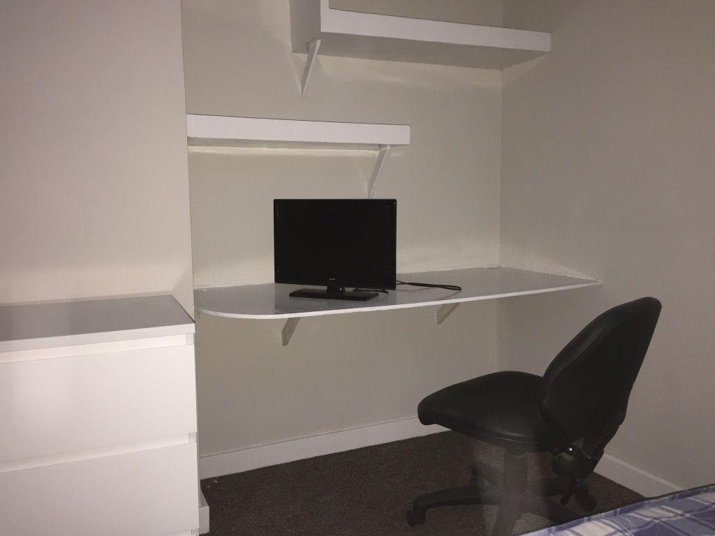 Compact, tidy bedroom workspace with a built-in...