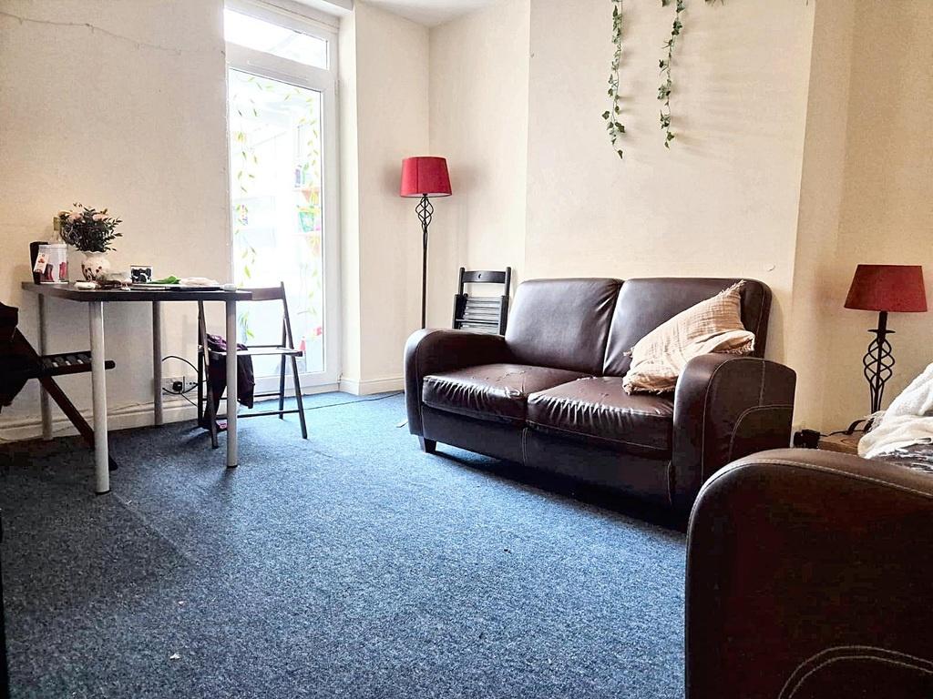 Bright, tidy living room with a comfortable two...