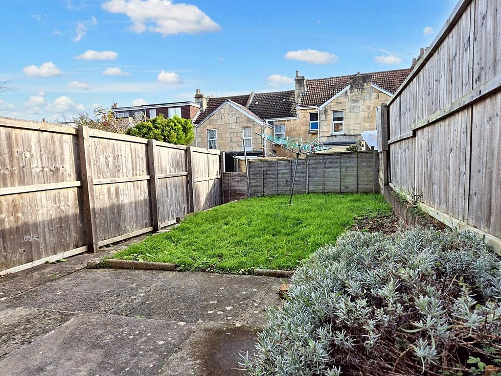Enclosed rear garden with a paved patio area le...