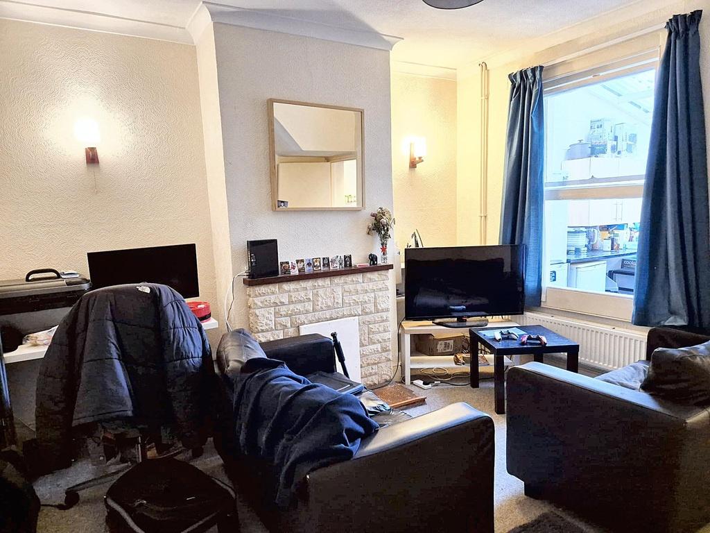 Bright, comfortable living room with a feature ...