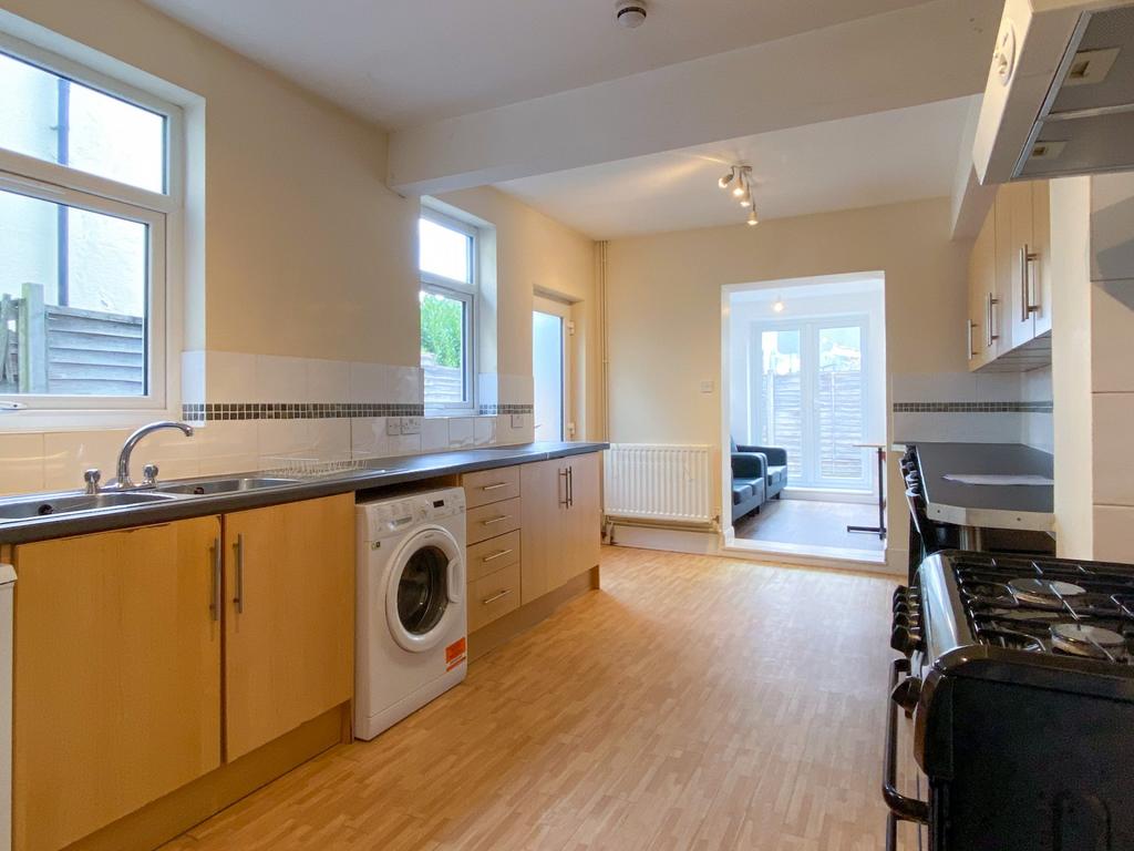 A bright and spacious kitchen with wooden cabin...