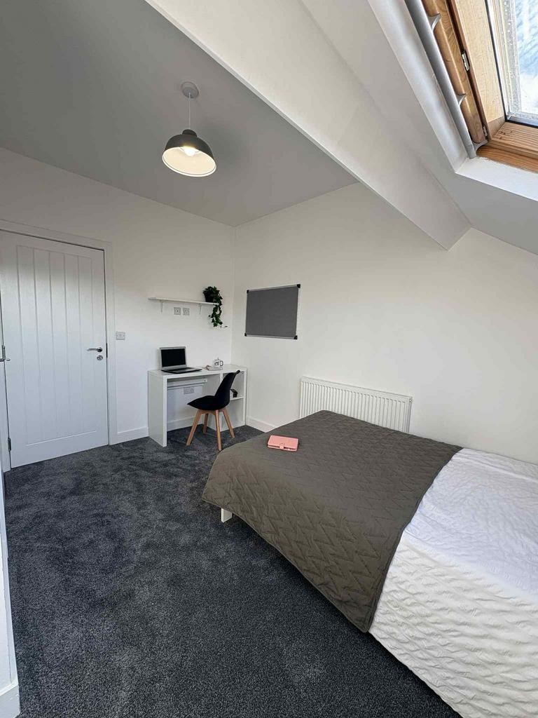 Bright, neatly presented bedroom with a double ...