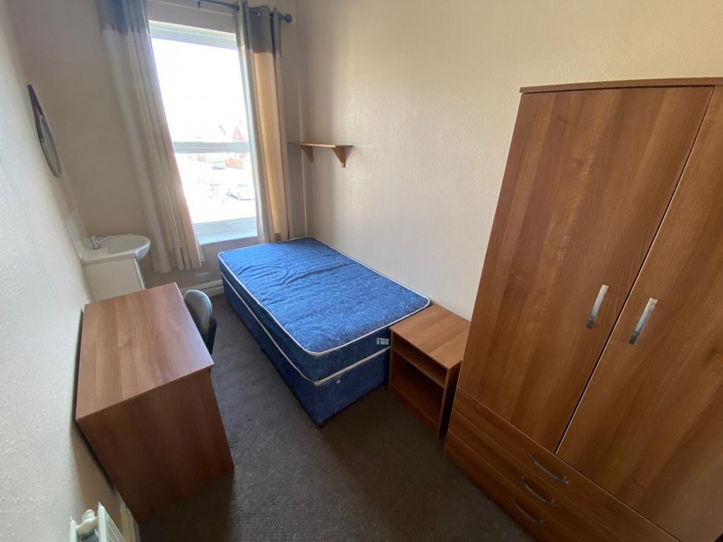 A cozy and well-lit double bedroom, perfect for...