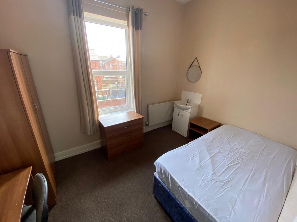 A bright and tidy double bedroom with ample nat...