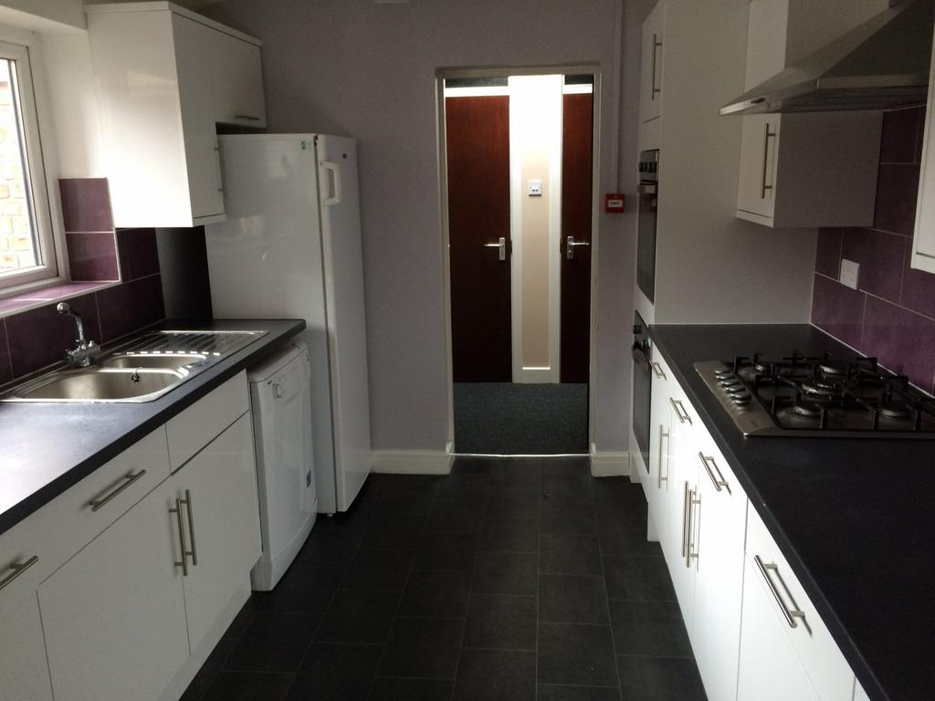 A modern and tidy kitchen with ample storage an...