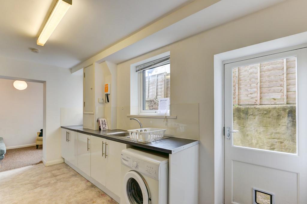 Bright and clean kitchen area with ample natura...