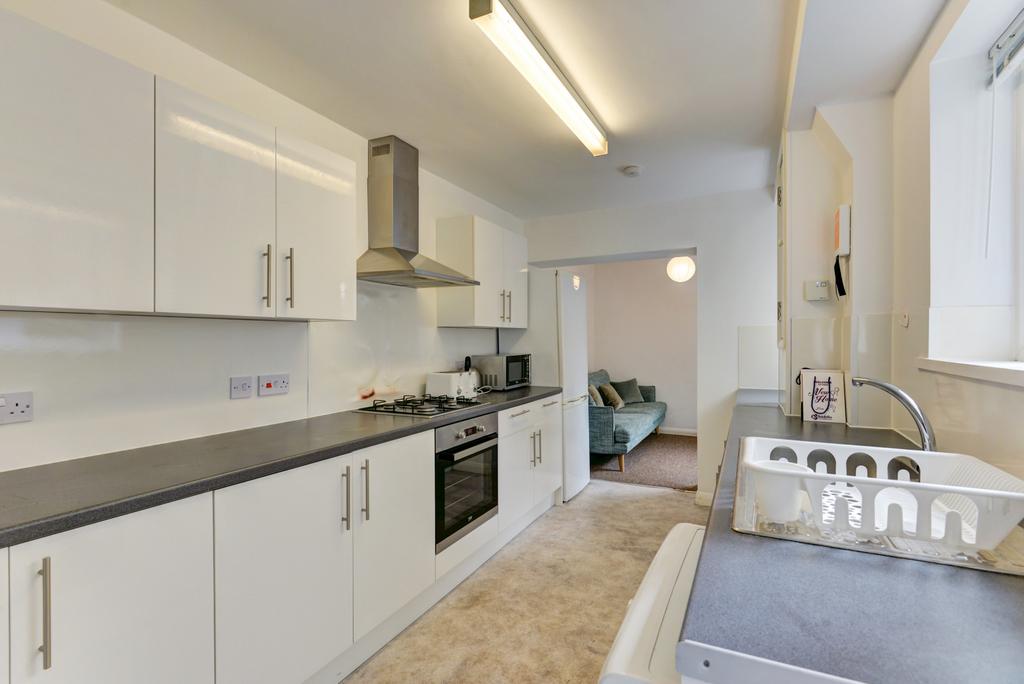 Bright and modern kitchen with ample counter sp...